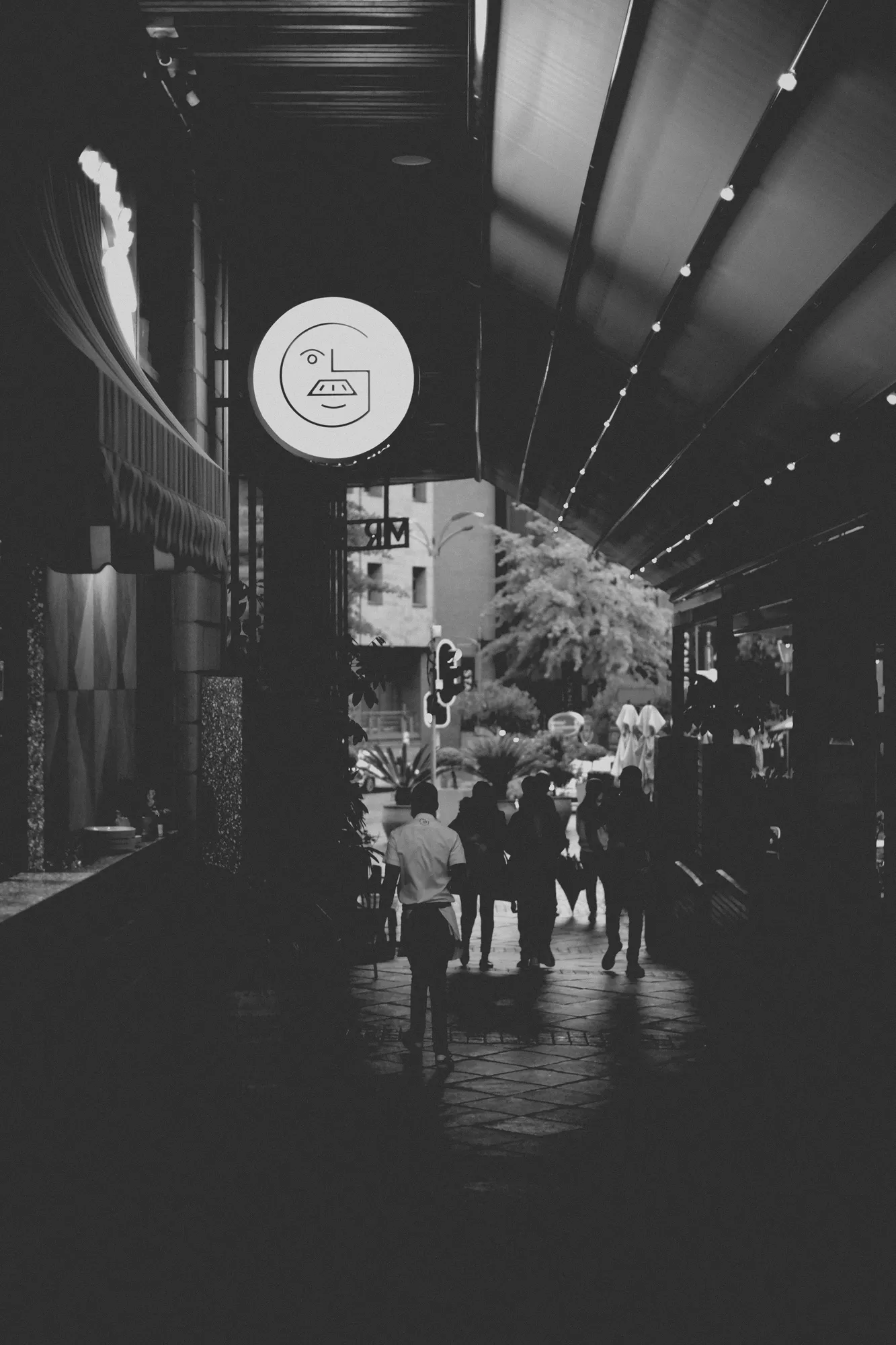 2021-12-04 - Melrose Arch, Johannesburg -  People waiting outside of restuarant